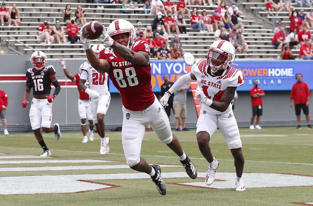 N.C. State wide receiver Devin Carter (88) pulls in a touchdown as Mario Love, Jr. (44) defends during the first half of N.C. State football&#8217;s spring game at Carter-Finley Stadium in Raleigh, N.C., Saturday, April 10, 2021.