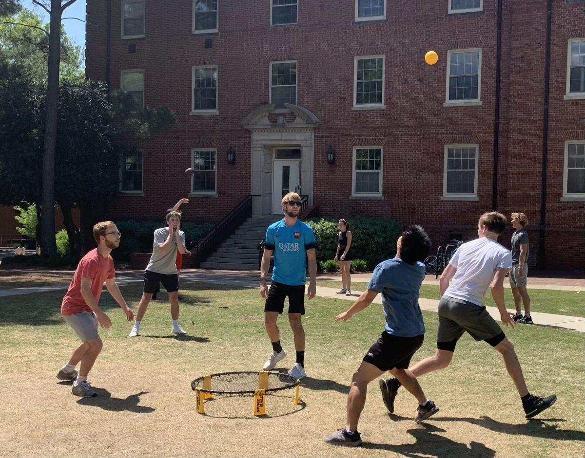 Students play spikeball on the field between Alexander and Turlington halls on April 30, 2021.&#160;