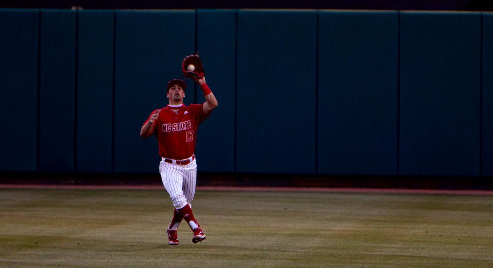 Sophomore outfielder Tyler McDonough catches a fly ball against Virginia Tech on Friday, April 23, 2021 at Doak Field. The Wolfpack won 3-1.