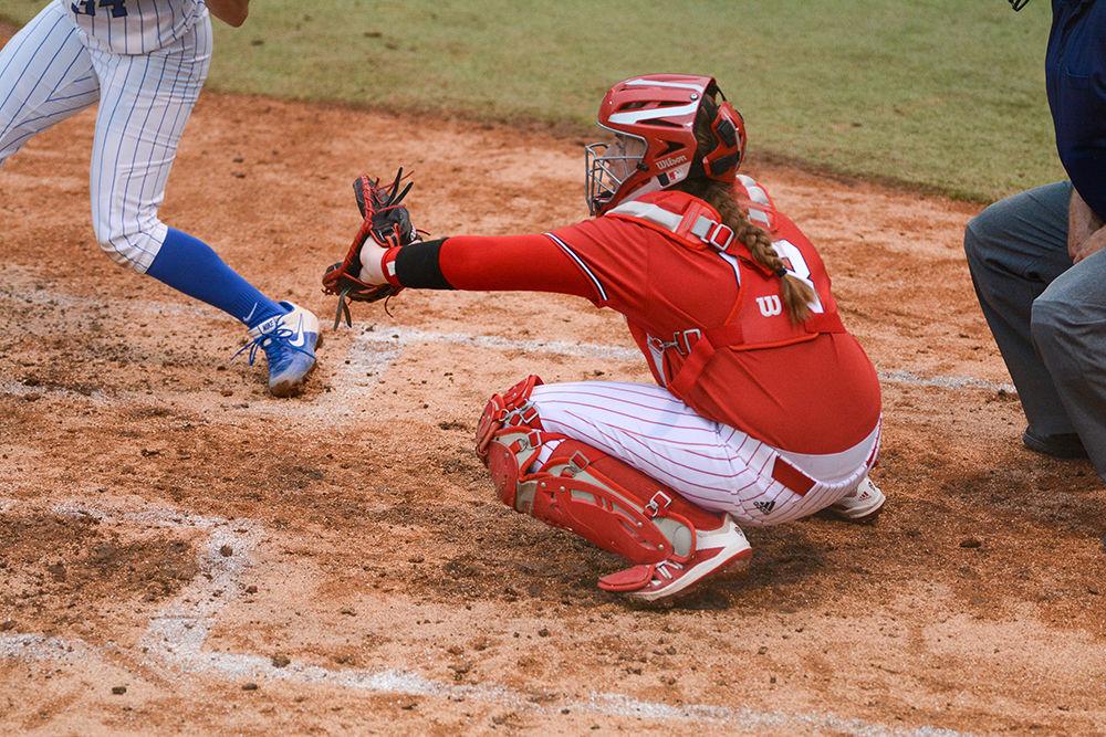 Sam Sack, a third year catcher, gets ready for the pitch at the softball game against Duke on Wednesday, Feb. 26, 2020 at Dail Field. The Wolfpack lost to Duke 1-5.