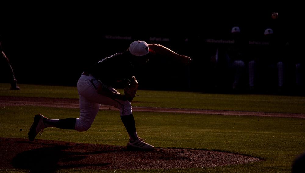 Freshman pitcher Chris Villaman delivers the ball against UNC-Wilmington on Tuesday, May 11, 2021 at Doak Field. Villaman pitched eight innings, striking out 12 while giving up one earned run on two hits. The Wolfpack won 9-1.