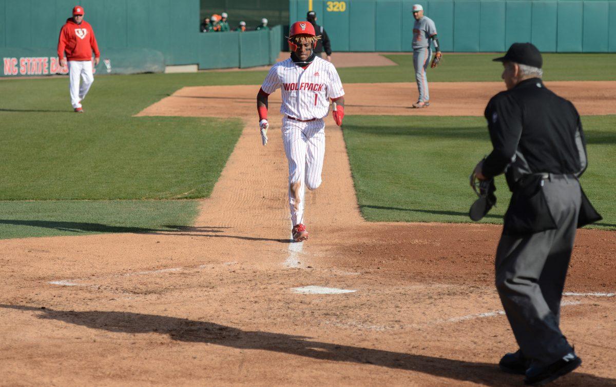 Junior outfielder Tarrell Tatum runs home after a passed ball on Friday, March 5, 2021 at Doak Field. Tatum acted as designated hitter during the Wolfpack&#8217;s 11-5 win over the sixth ranked Miami Hurricanes.