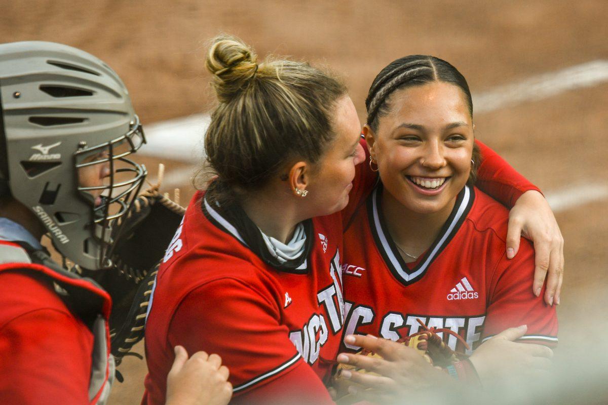 Freshman pitcher Estelle Czech is met by her teammates after striking out a Louisiana State hitter on Saturday, April 18, 2021 in Dail Softball Stadium. The Wolfpack lost to the Tigers 2-1.