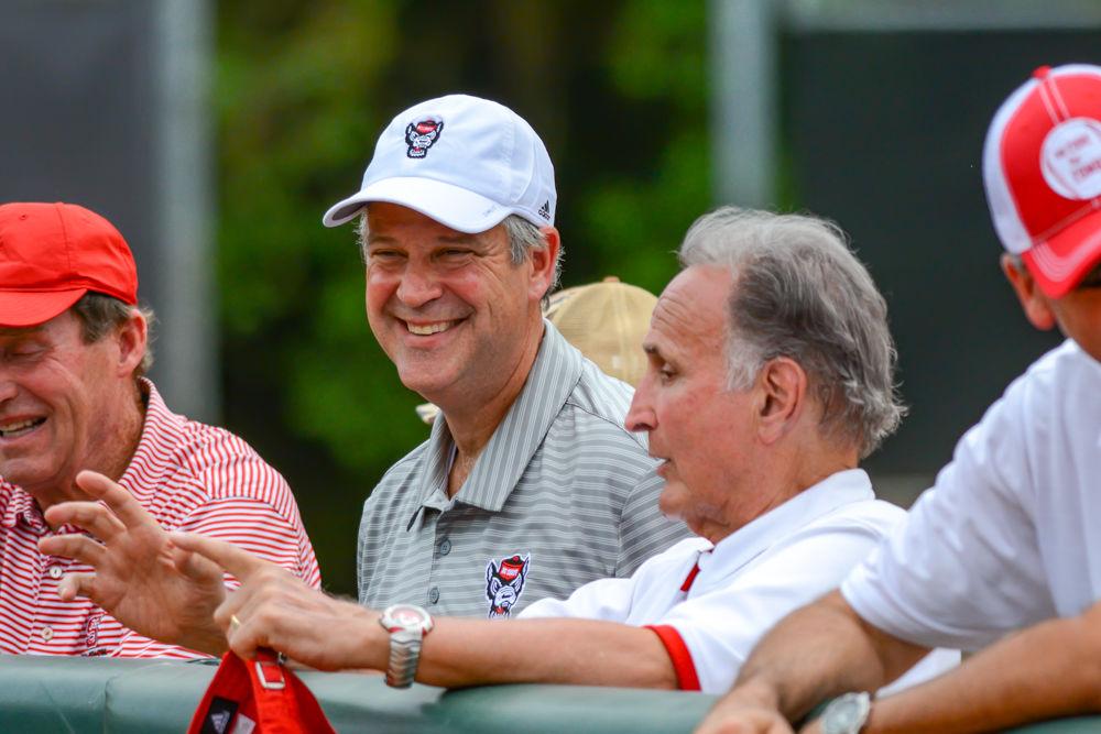 Director of Athletics Boo Corrigan and former football head coach Chuck Amato enjoy the baseball game against Clemson on Saturday, May 11, 2019 at Doak Field. The Wolfpack lost 4-3 in ten innings.