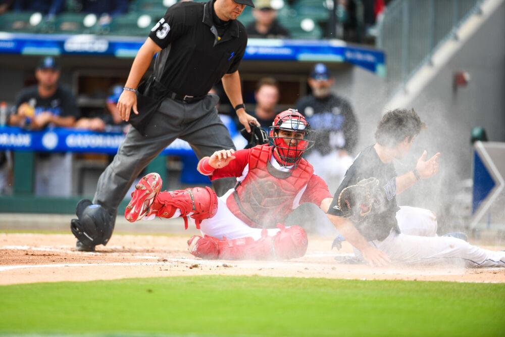 Sophomore catcher Luca Tresh tags Duke player Graham Pauley during the ACC Championship game at Truist Field Sunday, May 30, 2021. NC State fell 1-0 to capture the championship.