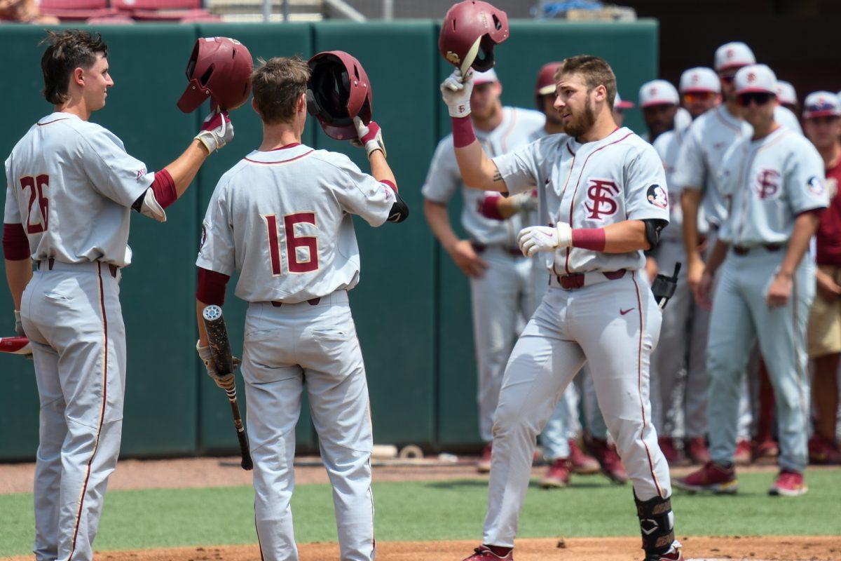 Florida State redshirt sophomore catcher Matheu Nelson celebrates his home run hit during the game versus the NC State Wolfpack on Saturday, May 22, 2021 in Doak Field at Dail Park. The Seminoles beat the Wolfpack 15-11.