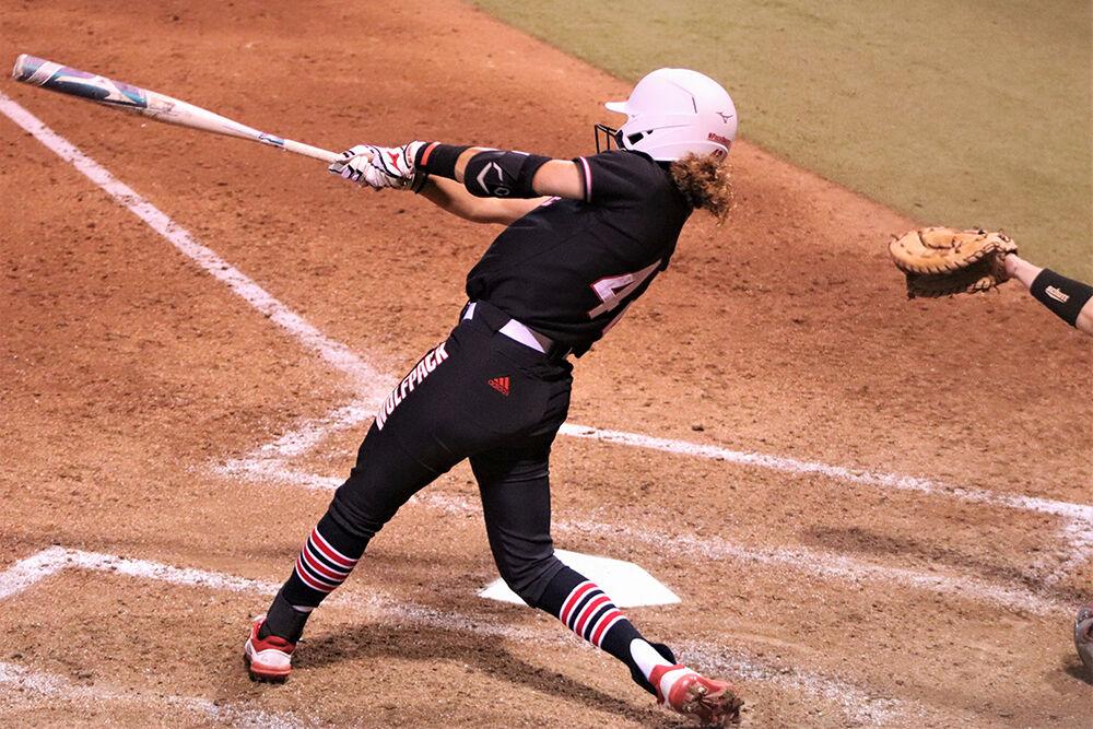 Angie Rizzi, a redshirt senior, swings her bat in the game against Virginia Tech on Friday, Mar. 12 at Dail Softball Field. The Wolfpack lost 2-4.