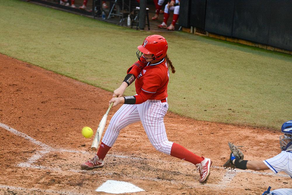 Sam Sack, a third year catcher, swings at the softball game against Duke on Wednesday, Feb. 26, 2020 at Dail Field. The Wolfpack lost to Duke 1-5.