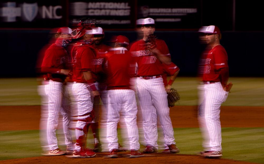 Head coach Elliott Avent calls a mound visit to replace freshman pitcher Sam Highfill on Friday, April 23, 2021 at Doak Field. Highfill struck out six and gave up no earned runs in 6.2 innings as the Wolfpack won 3-1.