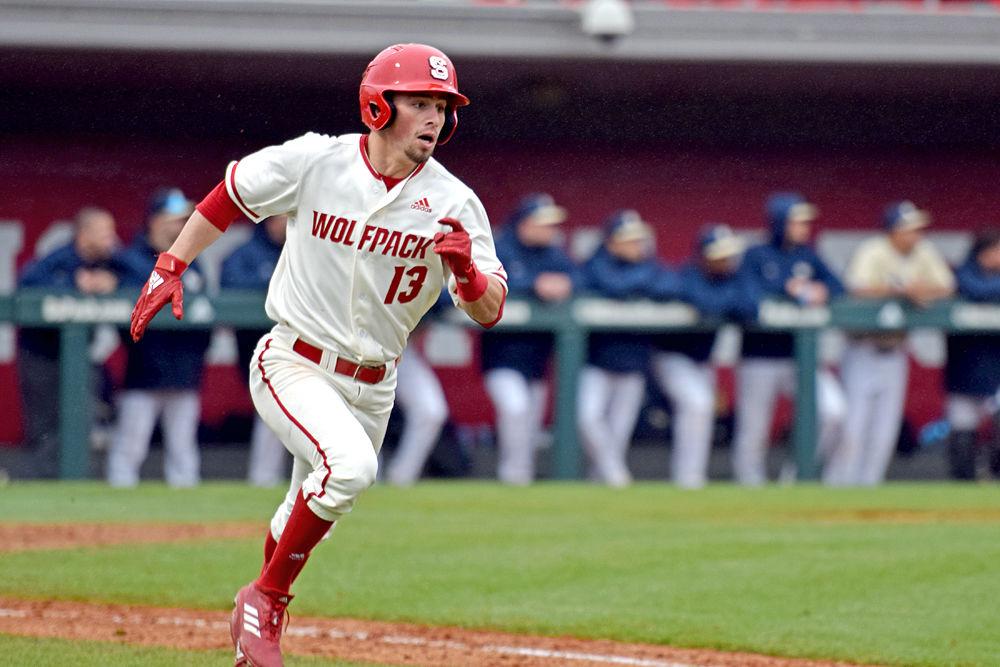 Freshman infielder Tyler McDonough sprints to first base against Pittsburgh on Saturday, March 9, 2019 at Doak Field. The Wolfpack won 21-3.