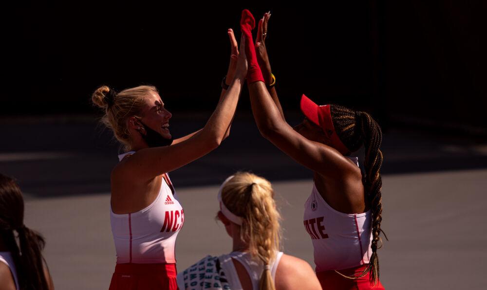 Fifth-year Anna Rogers and senior Jaeda Daniel celebrate Daniel&#8217;s match-clinching win against Iowa State on Saturday, May 8, 2021 at J.W. Isenhour Tennis Center. The Wolfpack won 4-2 to advance to the third round of NCAA Championships.