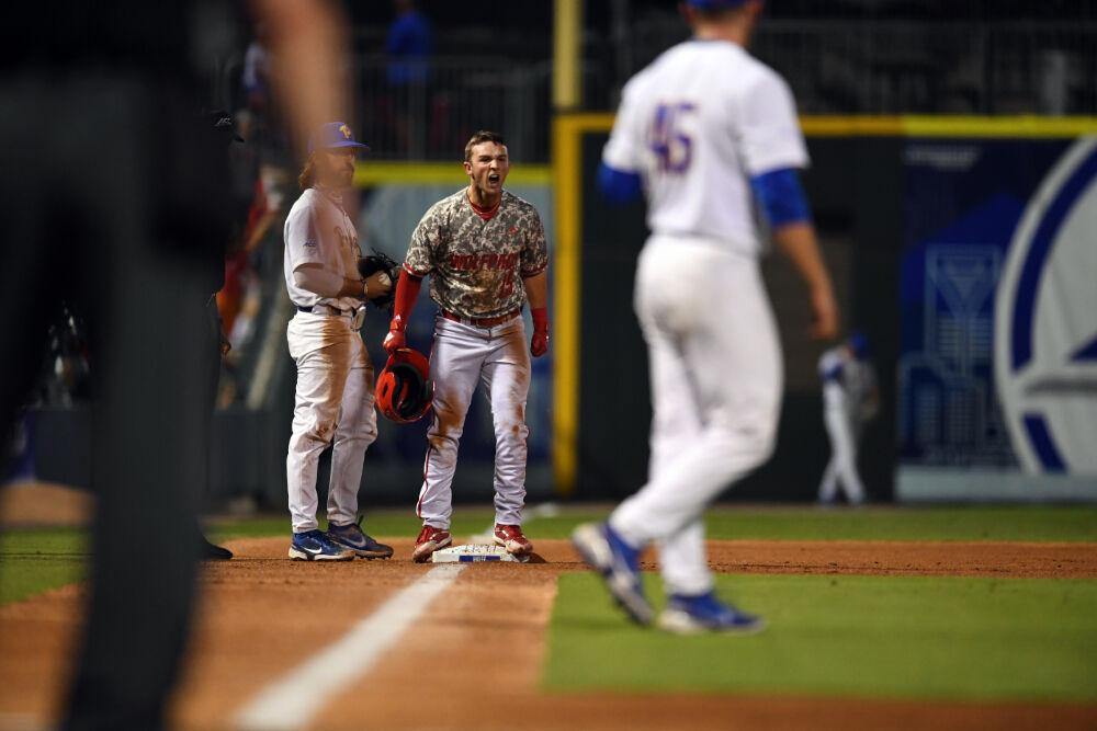 Junior infielder J.T. Jarrett yells once getting to third base during the ACC Championship against Pitt on Thursday, May 27, 2021 at Truist Field in Charlotte.&#160;The Wolfpack beat the Panthers 3-2.
