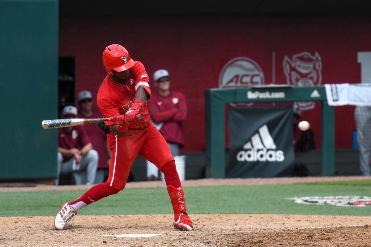 Junior infielder Devonte Brown swings at a pitch during the game versus the Florida State Seminoles on Saturday, May 22, 2021 in Doak Field at Dail Park. The Wolfpack lost to the Seminoles 15-11.