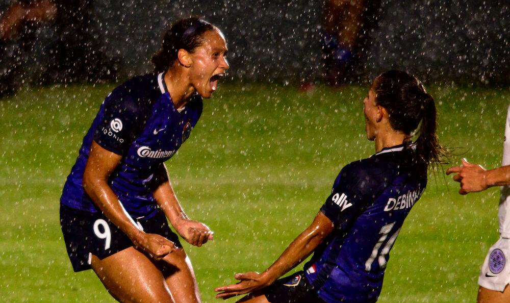 NC Courage forward Lynn Williams celebrates her goal assisted by midfielder Debinha on Friday, May 28, 2021 at WakeMed Soccer Park. The Courage beat Racing Louisville 5-0.