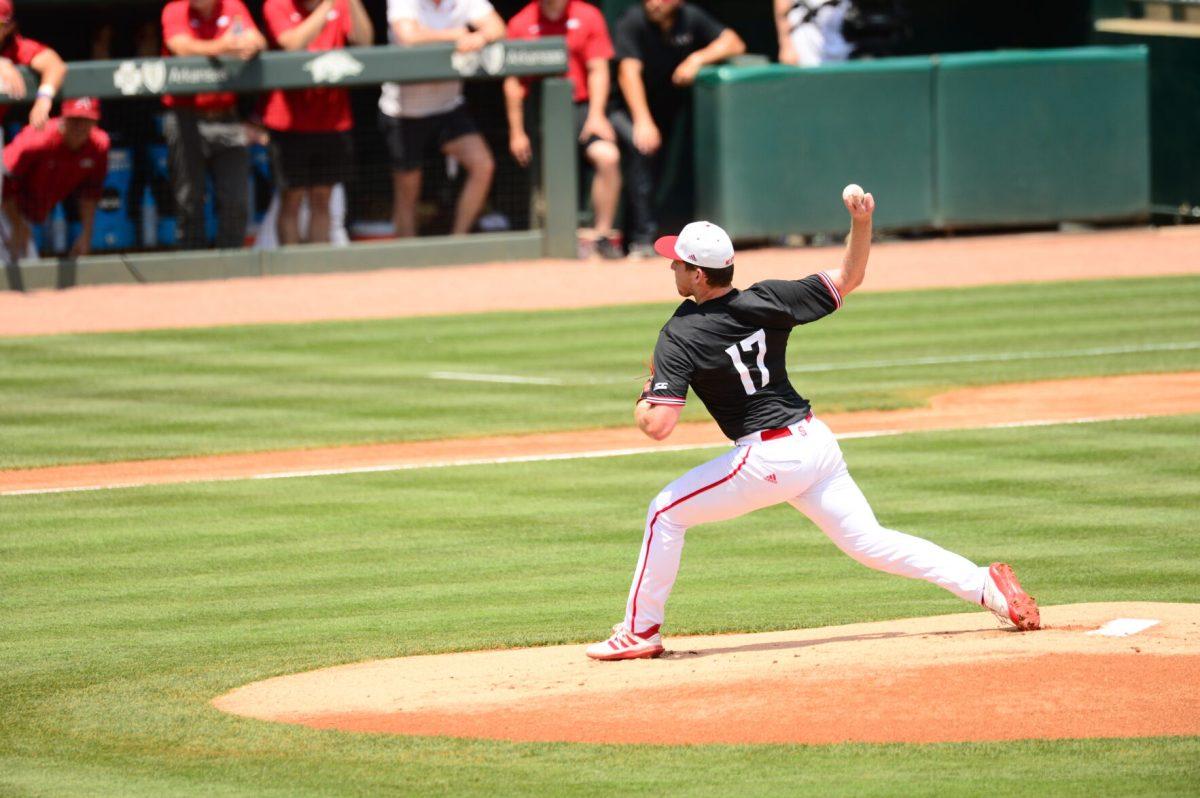 Freshman pitcher Sam Highfill throws a pitch against Arkansas in Game 2 of the Fayetteville Super Regional. The Wolfpack won the game 6-5 behind Highfill's excellent start.