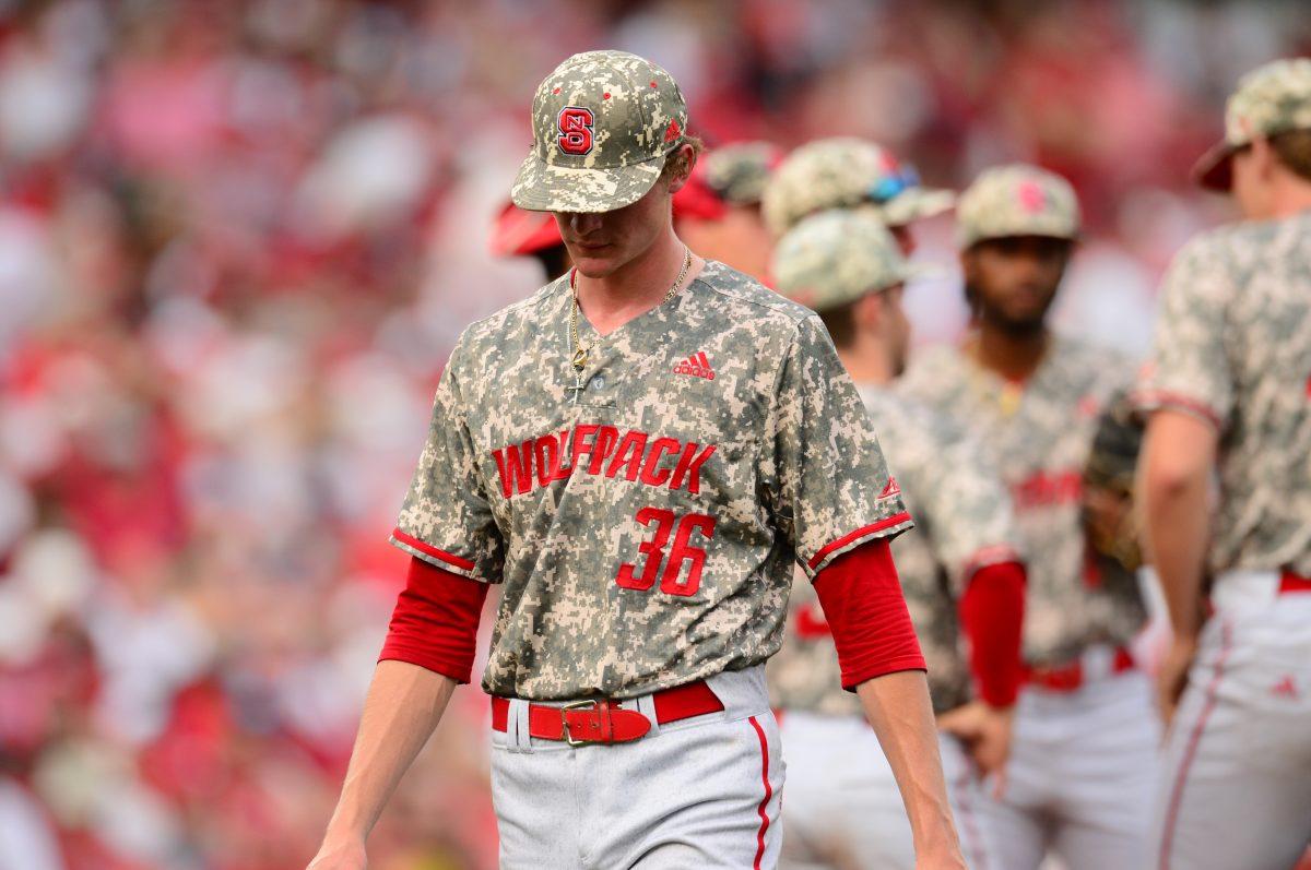 Freshman pitcher Garrett Payne heads off the mound after throwing 2.1 innings of relief in the first game of the Fayetteville Super Regional. Payne started well, striking out the side in the fourth, but gave up three in the fifth.