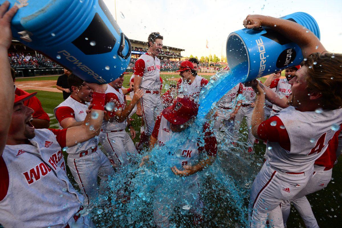 NC State baseball head coach Elliott Avent gets doused in Gatorade as the Wolfpack celebrates advancing to the College World Series. The Wolfpack won game three against Arkansas 3-2.