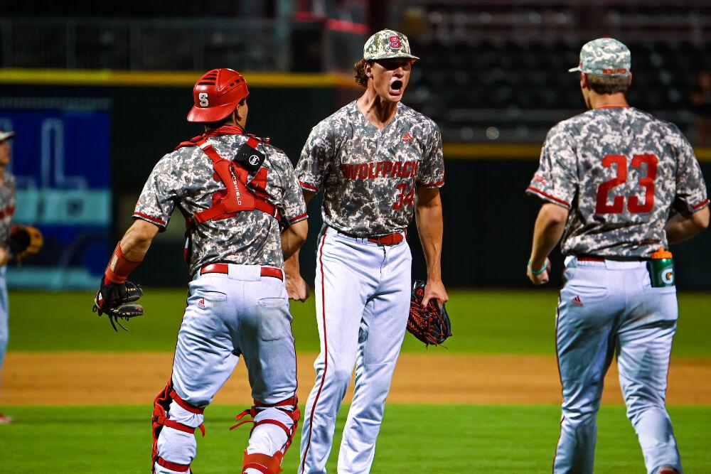 Junior pitcher Evan Justice celebrates with his teammates at the end of their game against Pitt during the ACC Championship on Thursday, May 27, 2021 at Truist Field in Charlotte.&#160;The Wolfpack beat the Panthers 3-2.