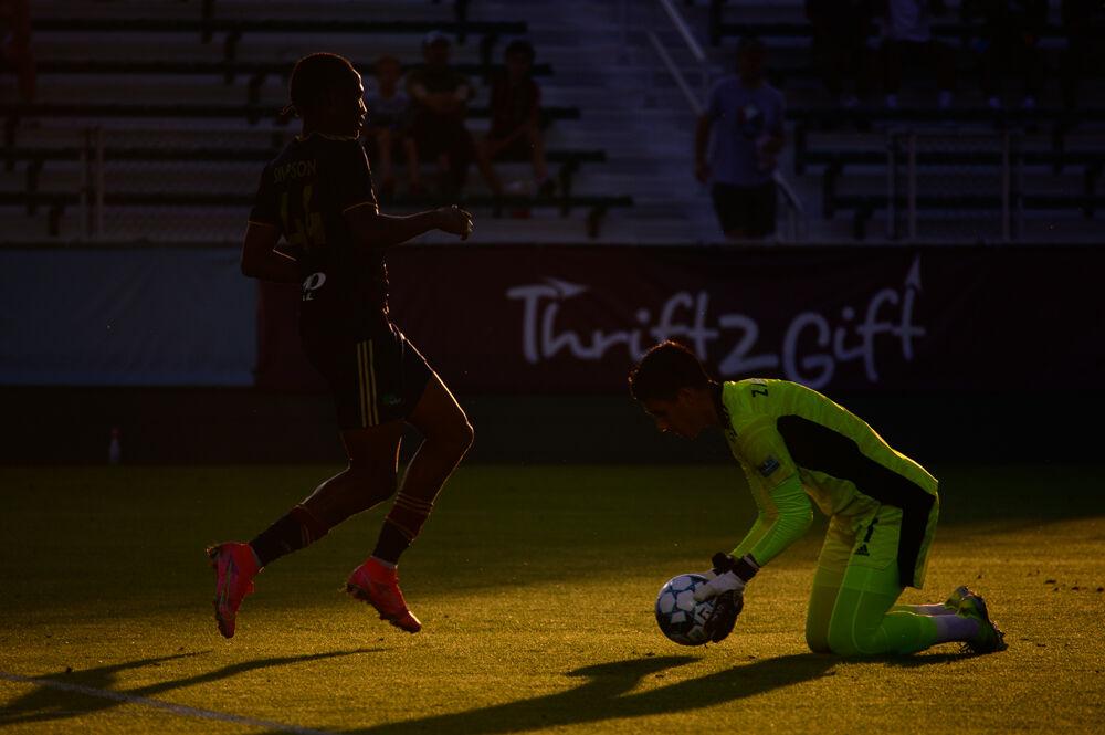 Fort Lauderdale CF goalkeeper Luis Zamudio secures the ball in front of NCFC forward Thorn Simpson on Saturday, June 5, 2021 at WakeMed Soccer Park. NCFC lost 2-1.
