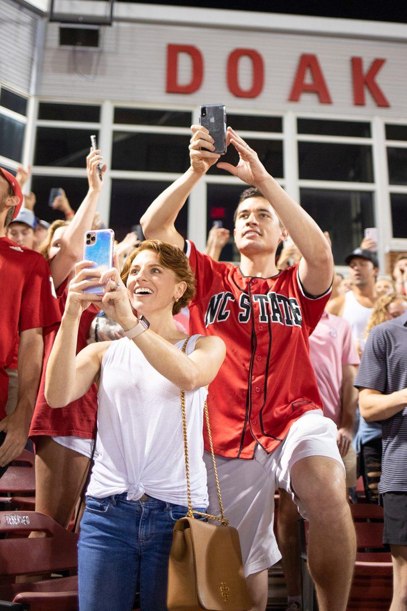 Mary and Taylor Sparrow show the NC State baseball team their support after the team's return from the College World Series at Doak Field at Dail Park on Friday, June 26, 2021.