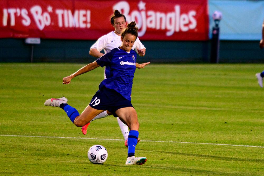 NC Courage midfielder Havana Solaun passes against Racing Louisville on Friday, May 28, 2021 at WakeMed Soccer Park. The Courage won 5-0.