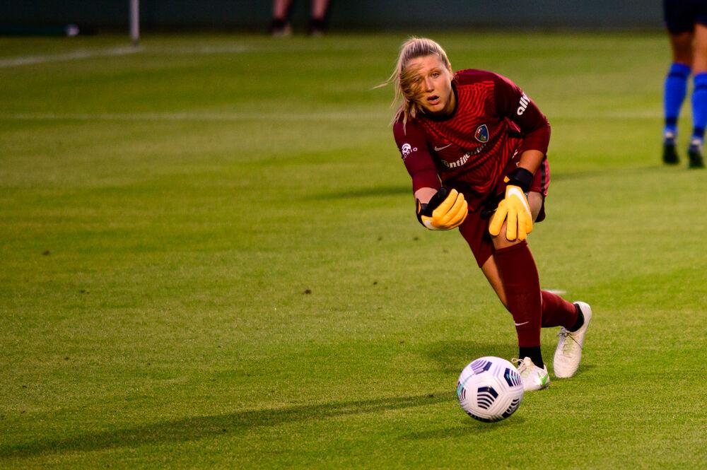 NC Courage goalkeeper Casey Murphy passes against Racing Louisville on Friday, May 28, 2021 at WakeMed Soccer Park. The Courage won 5-0.