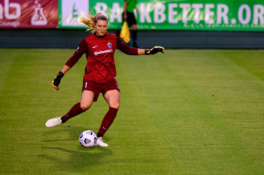 NC Courage goalkeeper Casey Murphy passes against Racing Louisville on Friday, May 28, 2021 at WakeMed Soccer Park. The Courage won 5-0.