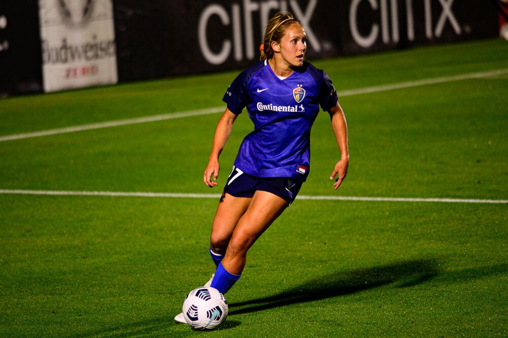 NC Courage forward Brittany Ratcliffe dribbles against Racing Louisville on Friday, May 28, 2021 at WakeMed Soccer Park. The Courage won 5-0.