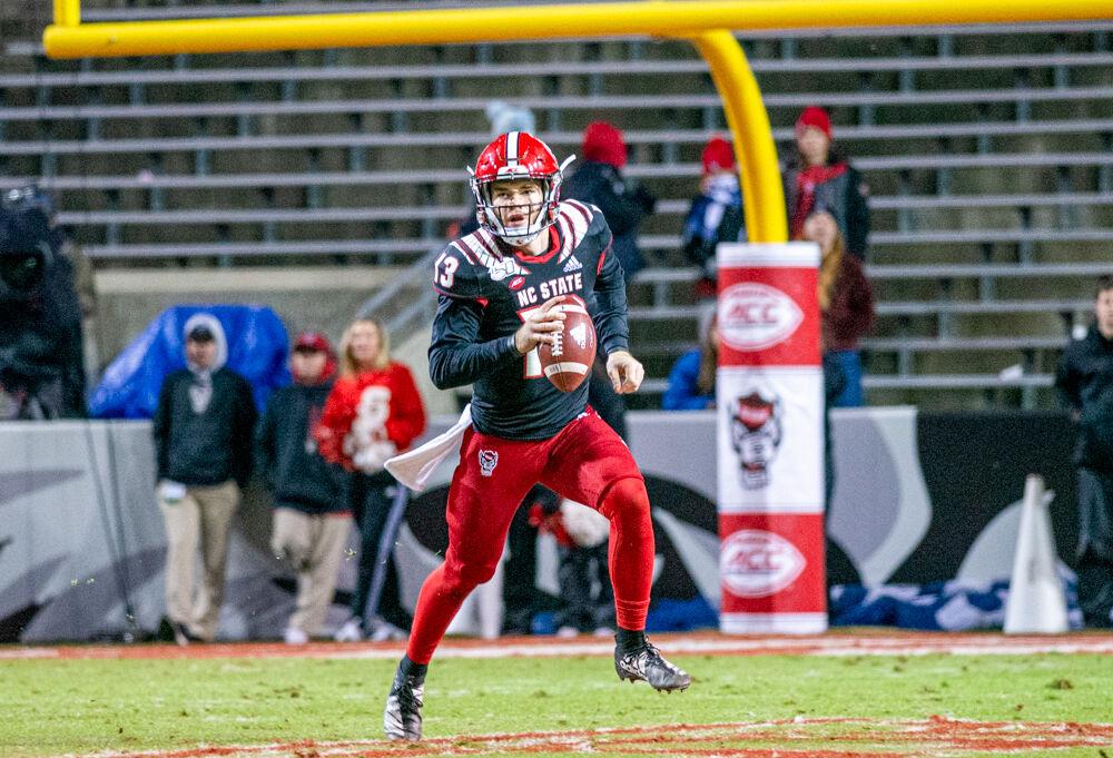 Redshirt freshman quarterback Devin Leary rushes versus Louisville on Saturday, Nov. 16, 2019 at Carter-Finley stadium. Leary threw for 243 yards and two touchdowns in the 34-20 loss.