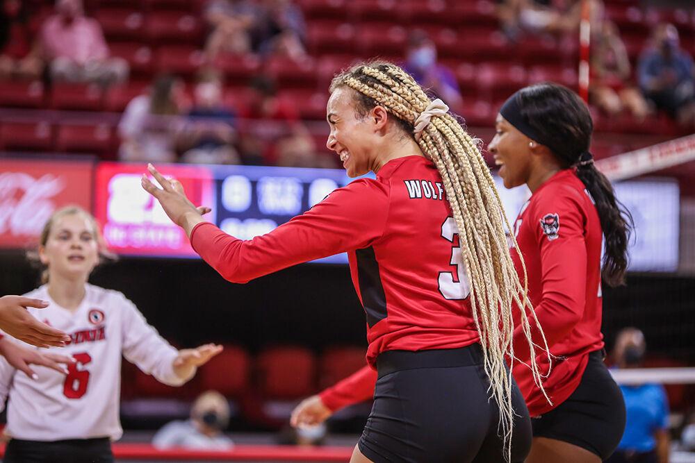 NC State graduate student Melissa Evans (3) celebrates a point during the Wolfpack's exhibition game against the Coastal Carolina Chanticleers in Reynolds Coliseum on Saturday, August 21, 2021. Coastal Carolina defeated the Wolfpack 3-1 in the exhibition match, their first match of the season.