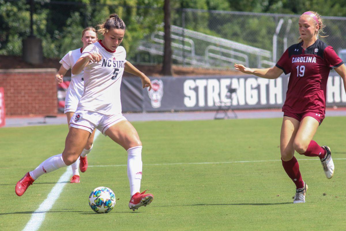 NC State Junior Jenna Butler saves the ball from going out of bounds during the NC State Wolfpack's soccer match against the South Carolina Gamecocks at the Dail Soccer Field on Saturday, August 29, 2021. The Wolfpack lost the match 2-1 on a last-minute score by the Gamecocks.