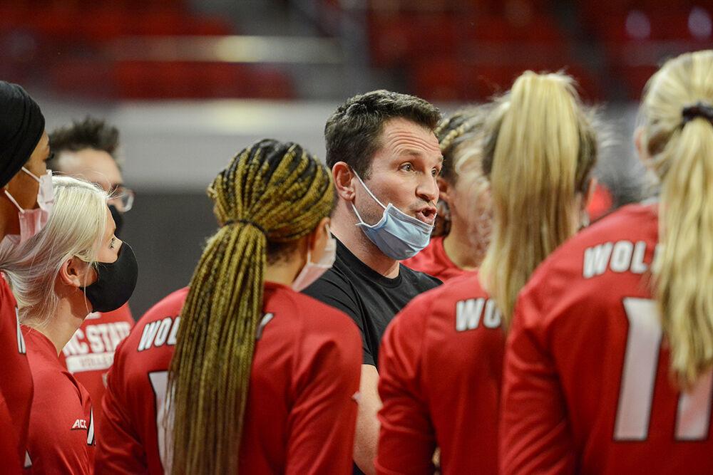 The NC State Wolfpack coach Luka Slabe addresses the team during a timeout against the Coastal Carolina Chanticleers in the first exhibition match of the season in Reynolds Coliseum on Saturday, August 21, 2021. The Chanticleers won the match 3-1. Slabe was an assistant coach for the 2020 US women's olympic volleyball team, which won gold.
