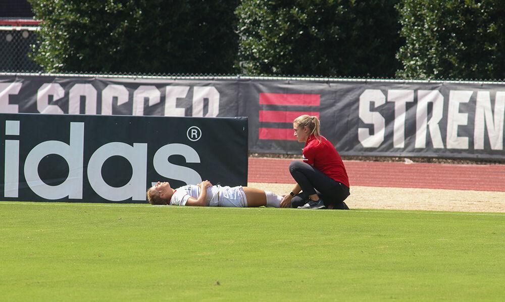 NC State freshman Fernanda Soto suffers an ankle injury during the NC State Wolfpack's soccer match against the South Carolina Gamecocks at the Dail Soccer Field on Saturday, August 29, 2021. The Wolfpack lost the match 2-1 on a last-minute score by the Gamecocks.