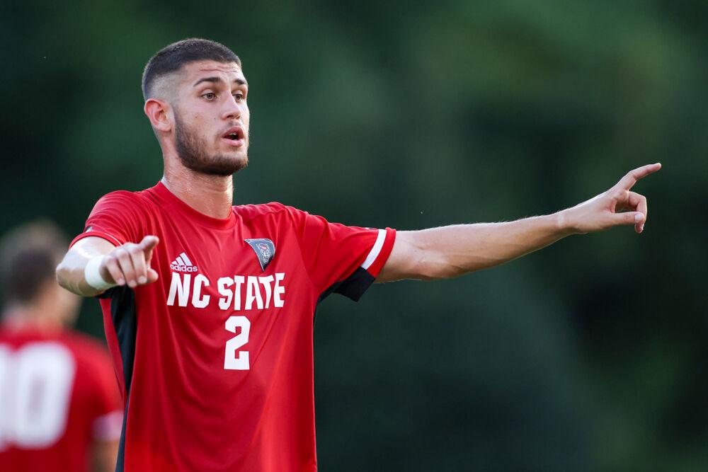 Juninor defenseman Pablo Pedregosa points talks to a teammate during the 4-0 win over UNC Asheville on Monday, Aug. 30, 2021.