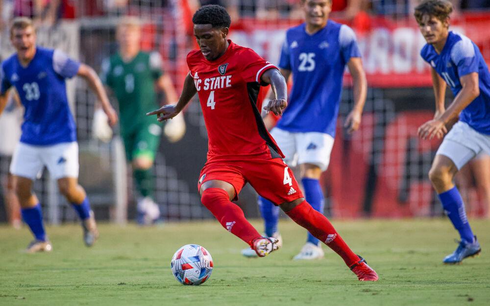 Freshman midfielder Vusumzi Plamana dribbles away from the defense in the 4-0 win over UNC Asheville on Monday, Aug. 30, 2021.