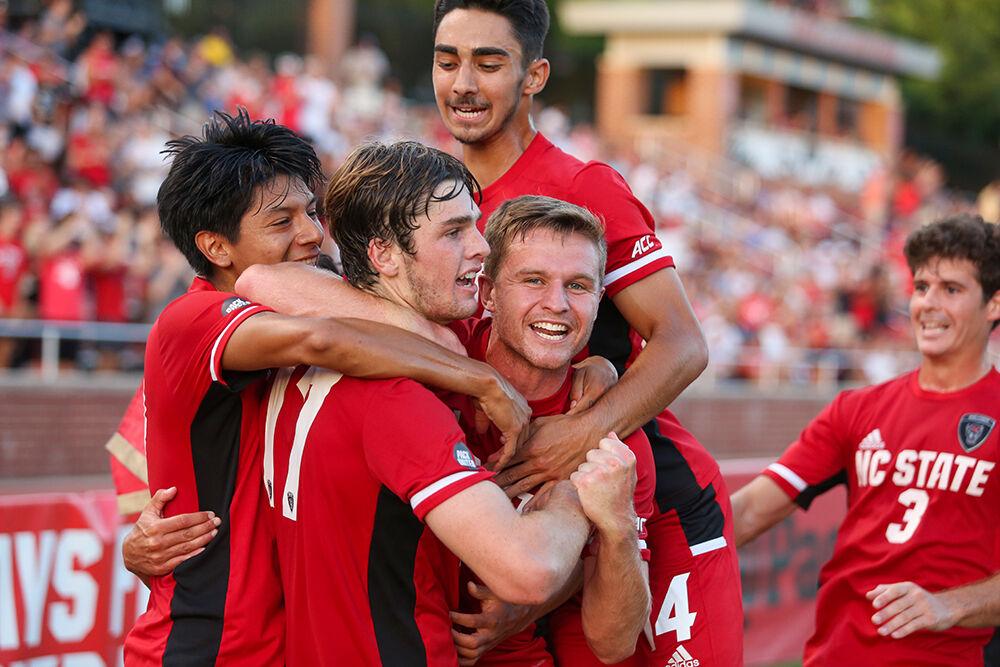 Freshman midfielder Luke Hille (17) celebrates with his teammates after scoring the first goal of the&#160;match against UNC Asheville at Dail Soccer Field on Monday, August 30, 2021. The Pack beat the Bulldogs 4-0.