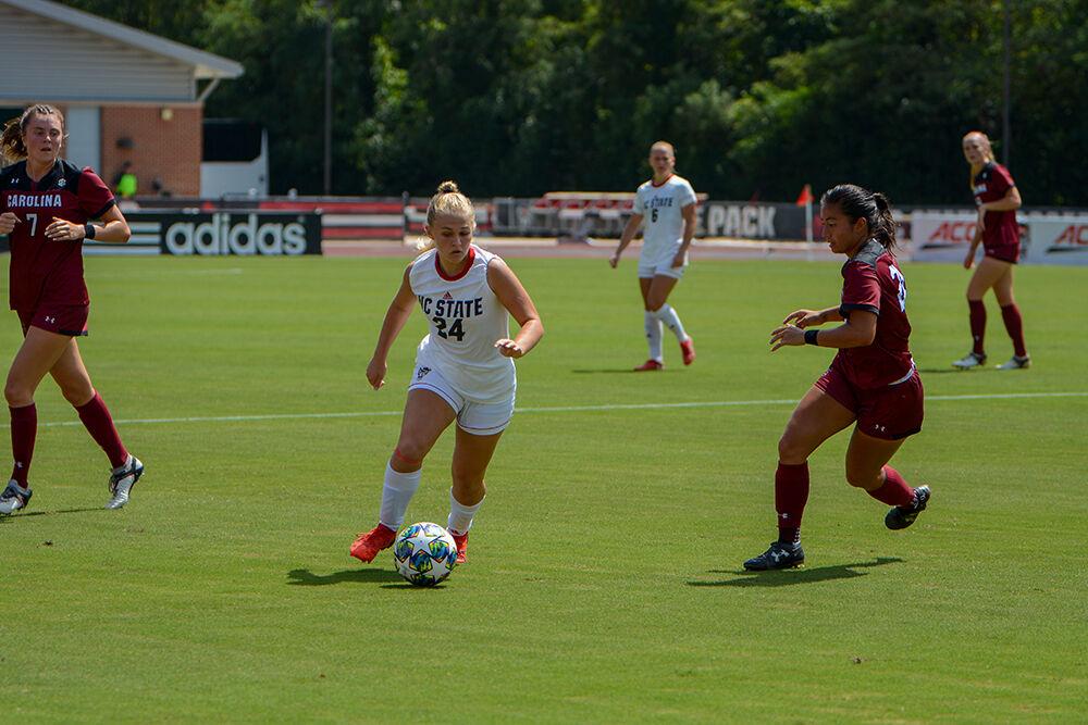 NC State freshman Samantha Castro (24) dribbles on the attack during the NC State Wolfpack's game against the South Carolina Gamecocks at Dail Soccer Field on Saturday, August 29, 2021. The Wolfpack lost the match 2-1 on a last-minute score by the Gamecocks.