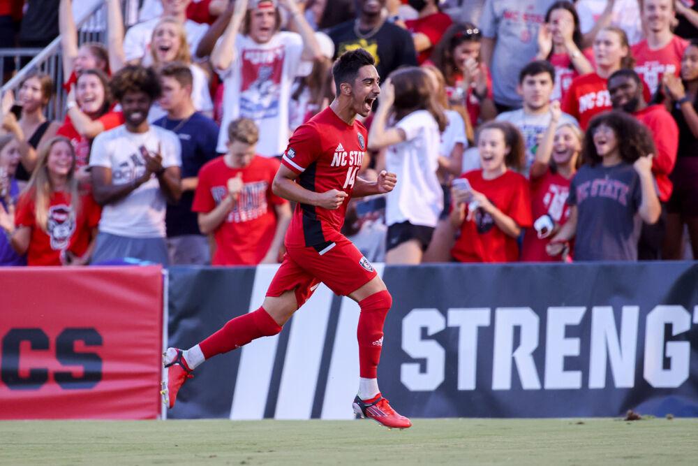 Freshman forward Henrique Santos runs past the fans after scoring a goal in the 4-0 win over UNC Asheville on Monday, Aug. 30, 2021.