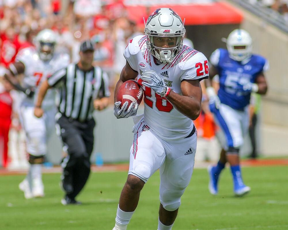 Freshman running back Trent Pennix makes the run after a double pass play. Pennix had 56 yards on the reception during the 41-7 win over Georgia State on Saturday, Sept. 8, 2018, in Carter-Finley Stadium.
