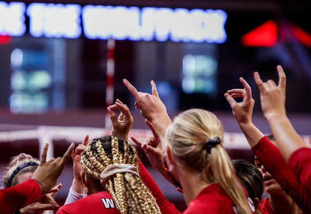 NC State's team comes together after a timeout during the Wolfpack's exhibition game against the Coastal Carolina Chanticleers in Reynolds Coliseum on Saturday, August 21, 2021. Coastal Carolina defeated the Wolfpack 3-1 in the exhibition match, their first match of the season.