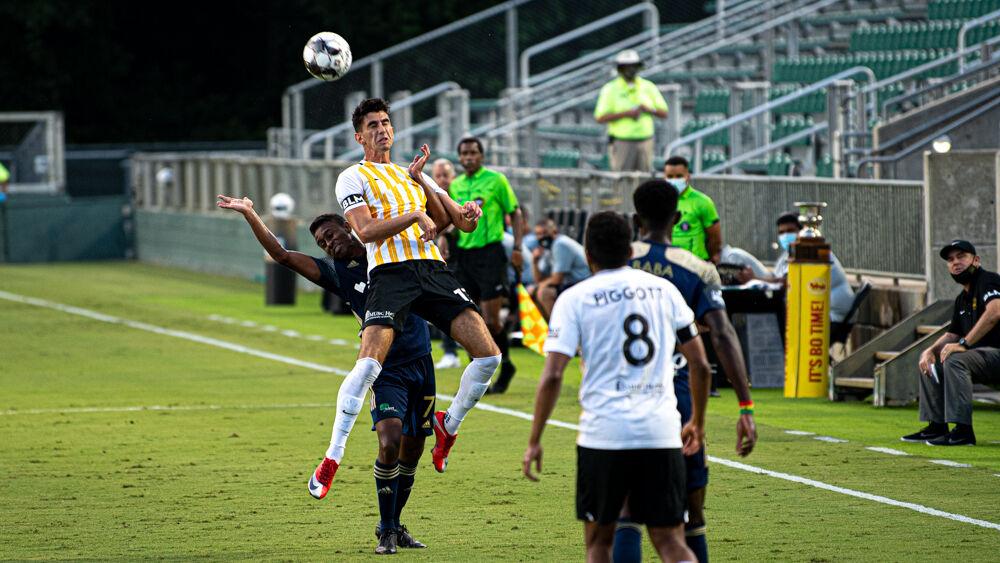 North Carolina FC midfielder Pecka leans away from contact against Charleston Battery on Wednesday, Aug. 19, 2020 at WakeMed Soccer Park. NCFC lost 3-0.
