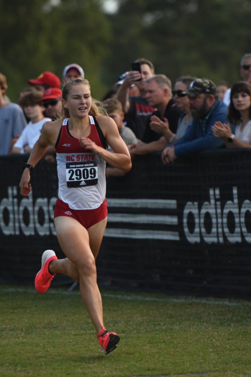 Sophomore Katelyn Tuohy crosses the finish line in the Adidas XC Challenge at Wake Med Soccer Park on Friday, Sept. 17, 2021. Tuohy led the race for the Wolfpack finishing first with a time of 16:29.6.