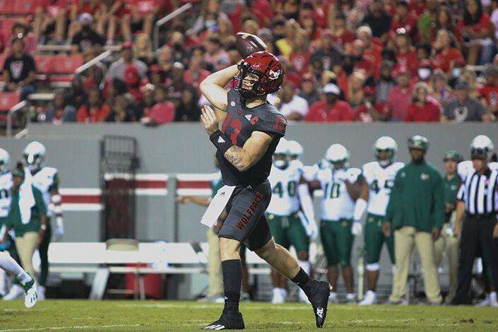 Redshirt sophomore quarterback Devin Leary throw the football towards a receiver during the Wolfpack's game against the South Florida Bulls at Carter-Finley Stadium on Thursday, Sept. 2, 2021. Leary threw 17/26 for 232 yards with two passing touchdowns. The Wolfpack beat the Bulls 45-0.