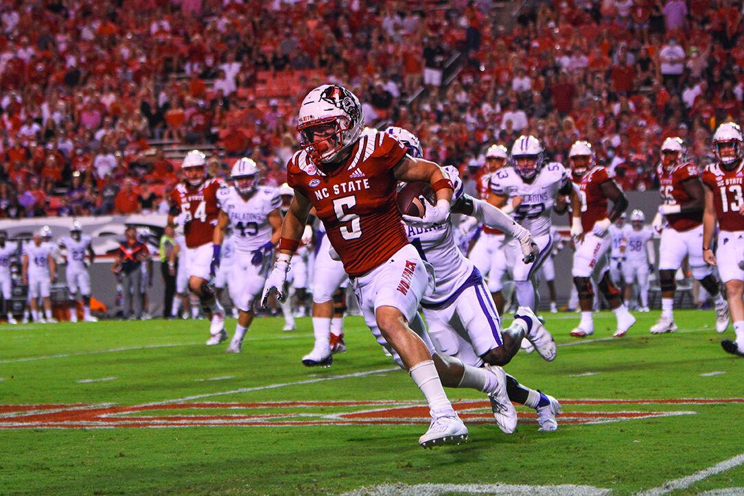 Redshirt graduate wide receiver Thayer Thomas runs the ball in the game against the Furman Paladins in Carter-Finley Stadium on Saturday, Sept 18, 2021. Thomas had a total of 82 receiving yards. The Wolfpack won 45-7.