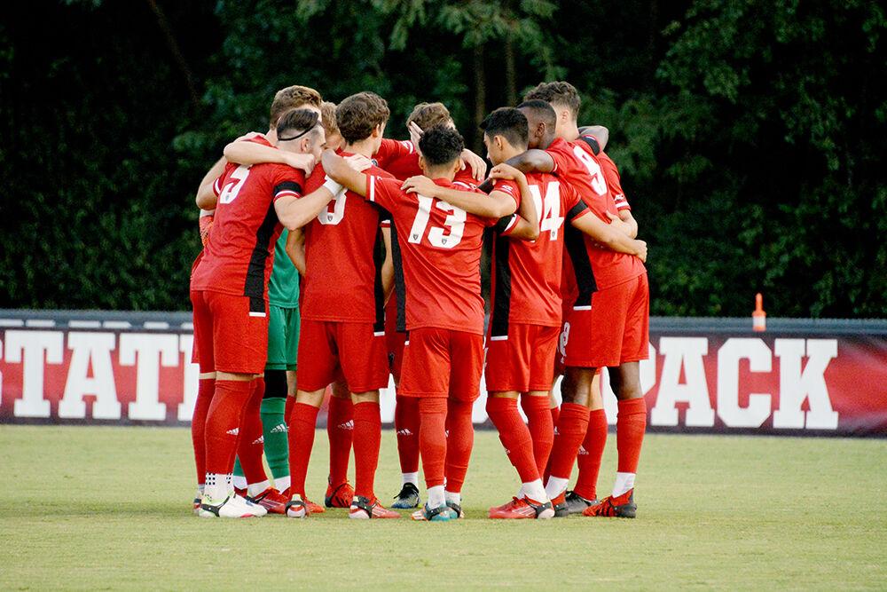 The Wolfpack huddles up before the start of the NC State Wolfpack's soccer match against the UCF Knights at Dail Soccer Field on Monday, Sep. 6, 2021. The Wolfpack won the match 2-1.