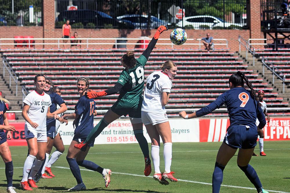 Freshman goalkeeper Maria Echezarreta knocks a ball away from the goal at NC State&#8217;s game against Virginia on Sunday, Sept. 26, 2021 at Dail Soccer Field. The Wolfpack lost to the Cavaliers 2-1.