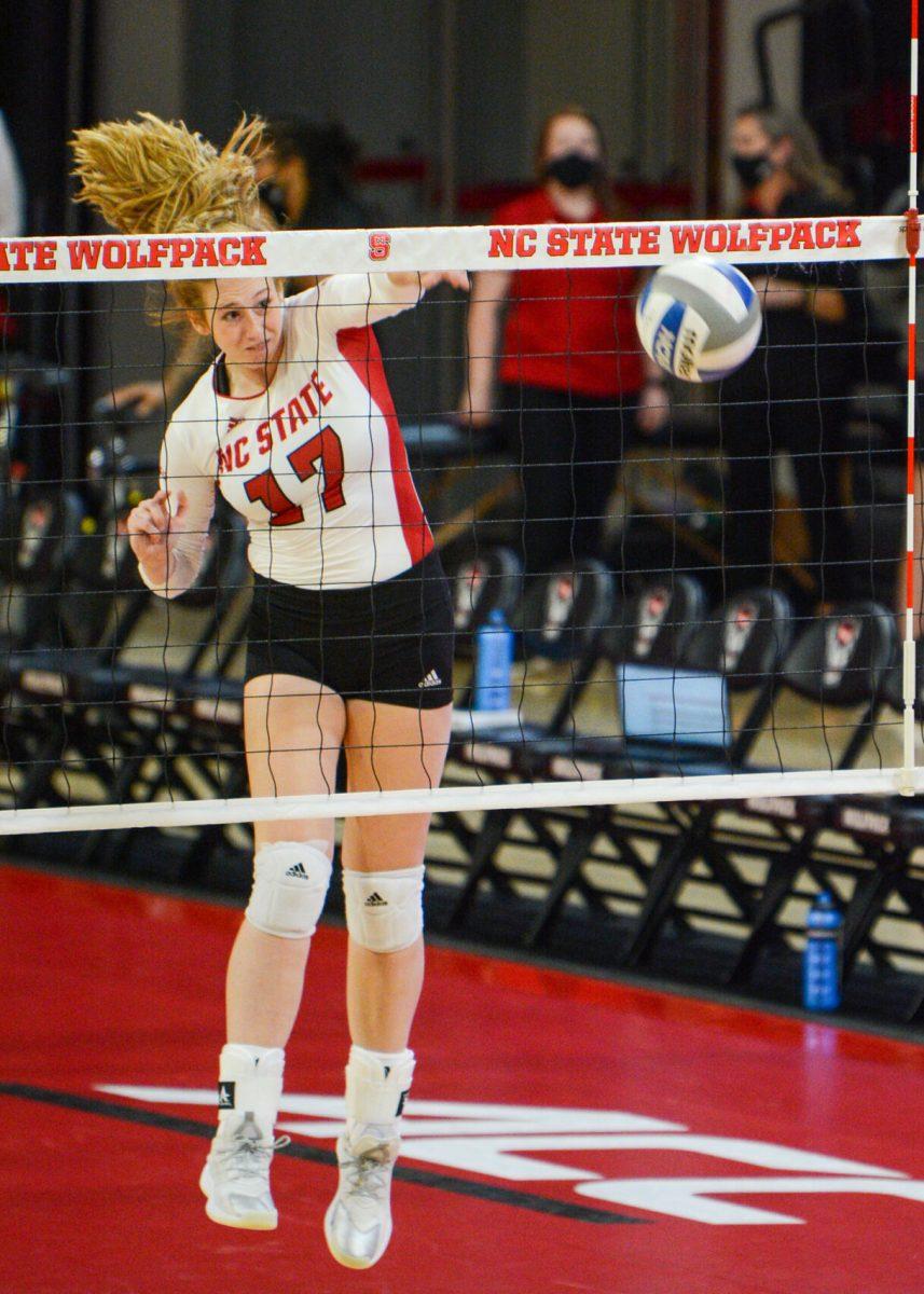Freshman middle blocker Amanda Rice spikes the ball during the NC state game against Wofford on Friday, Sept 3, 2021 in Reynolds Coliseum. The Wolfpack beat the Terriers 3-0.