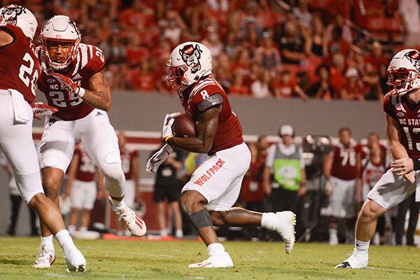 Junior runningback Ricky Person, Jr. runs the ball down the field during the game against Furman on Saturday, Sept. 18, 2021 at Carter-Finley Stadium. Person, Jr. had eight carries for 41 yards with one touchdown. The Wolfpack beat the Furman Paladins 45-7.