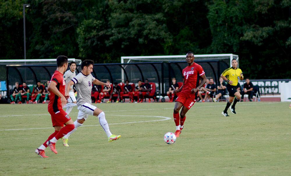 Senior forward Kuda Muskwe follows the ball while a UCF player dribbles on Monday, Sep. 6, 2021 at Dail Soccer Stadium. NC State defeated UCF 2-1.