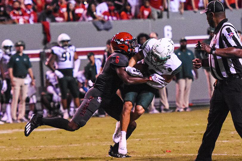 Sophomore safety Jakeen Harris tackles a Bulls player on Thursday, Sept. 2, 2021 in Carter-Finley Stadium. Jakeen Harris had four tackles in the game. The Wolfpack beat the Bulls 45-0.